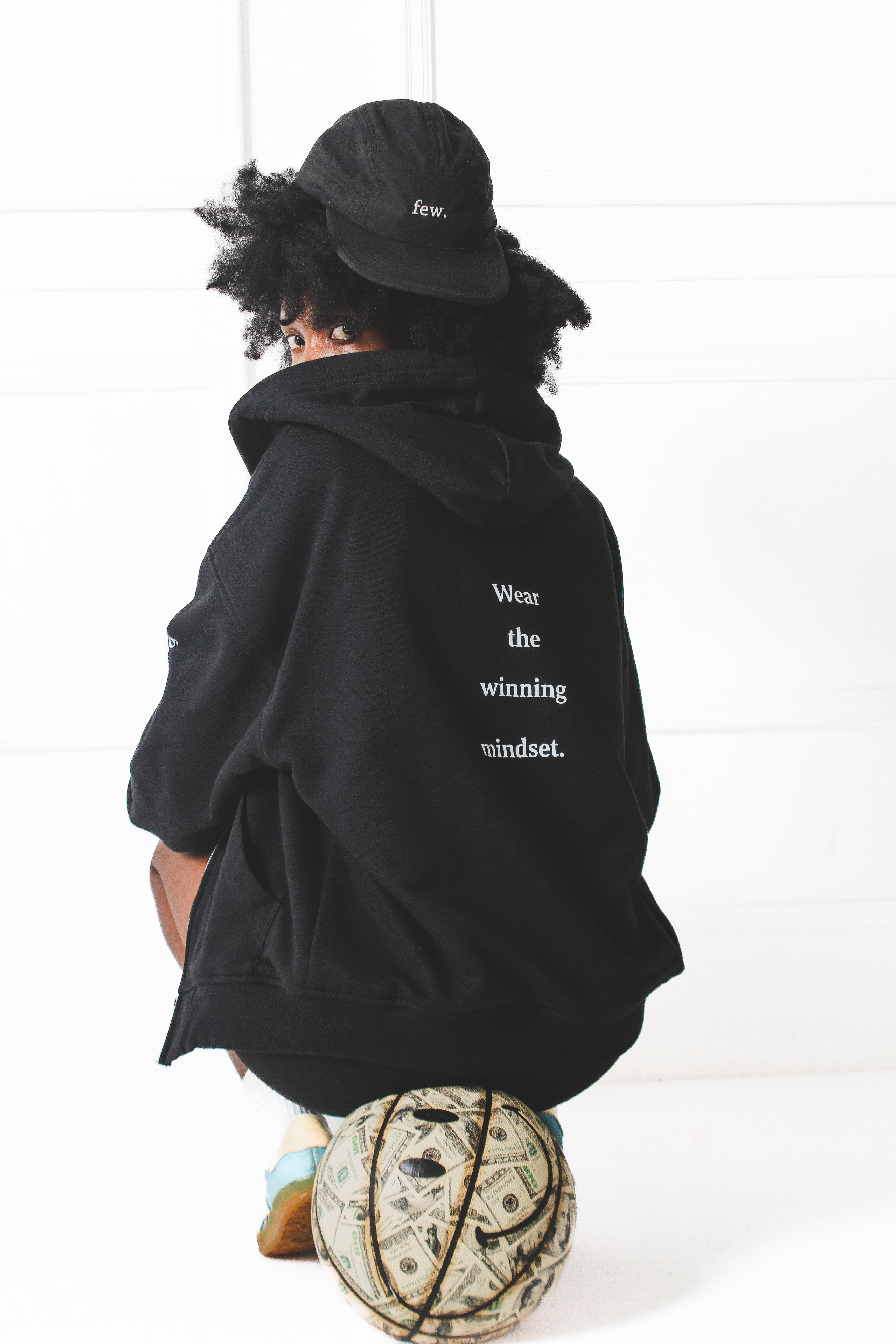 few. hoodie with Wear the winning mindset statement visible