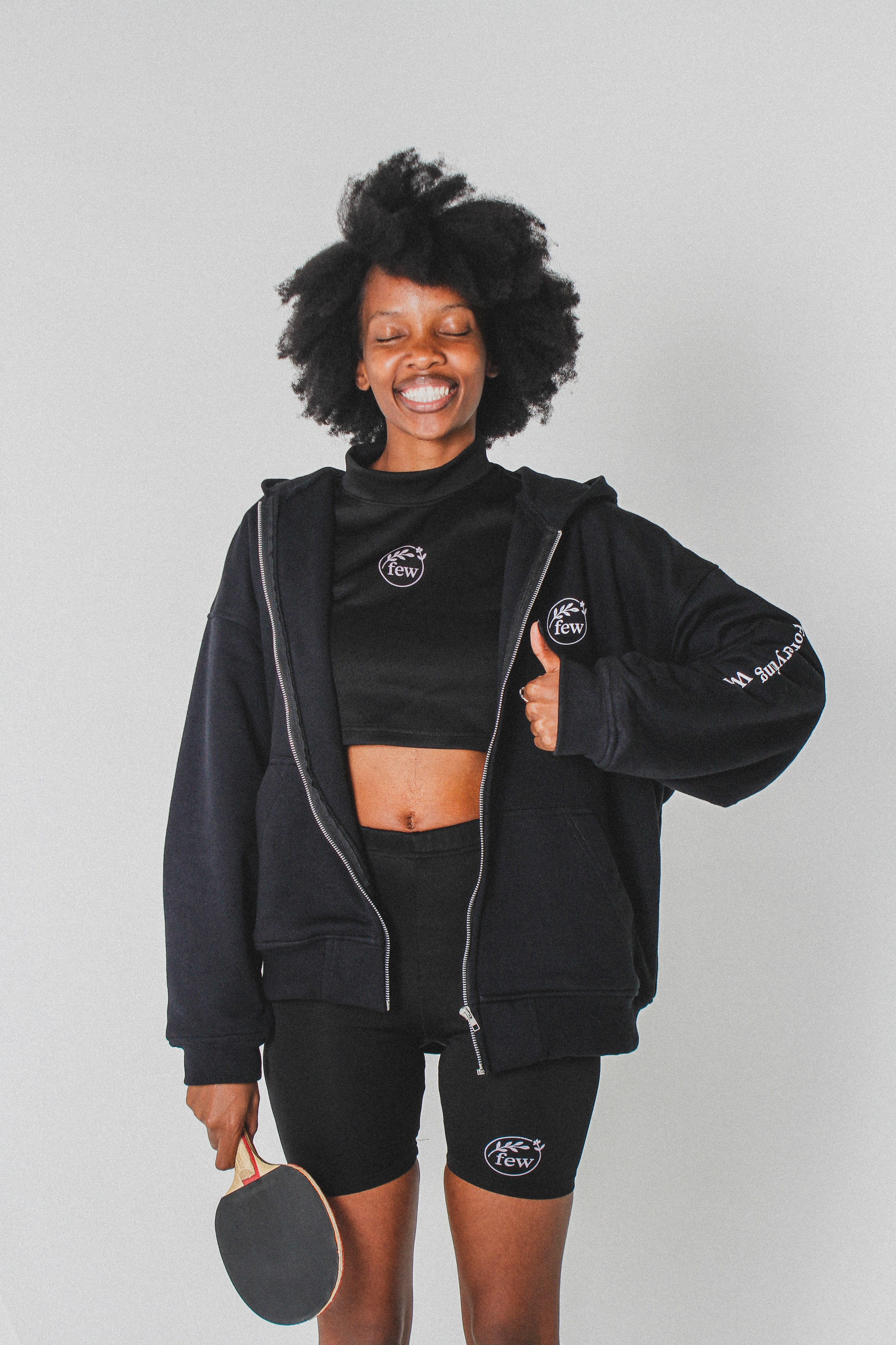 few. black gym fit worn with a hoodie and shorts