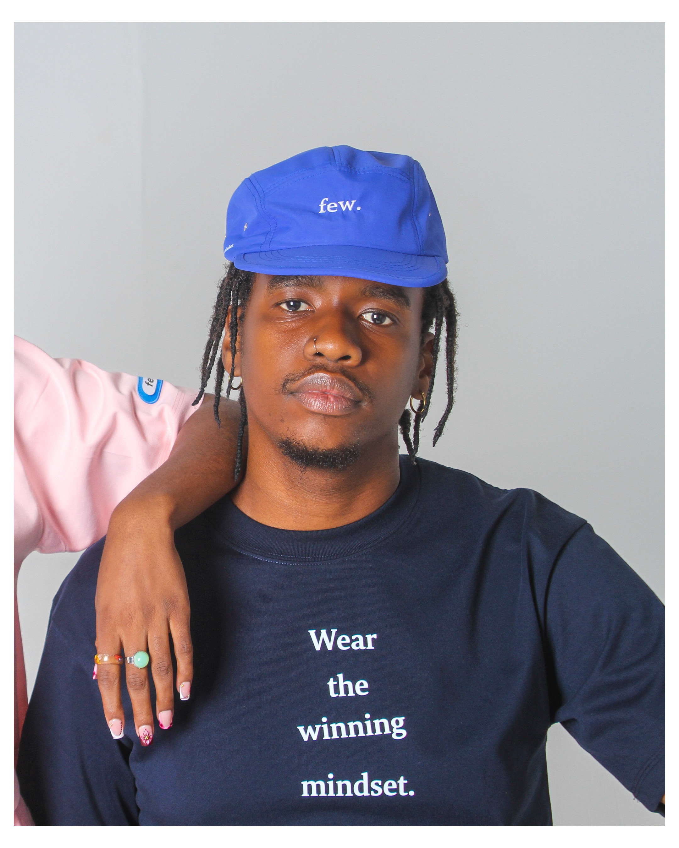 few. cap and navy top portrait